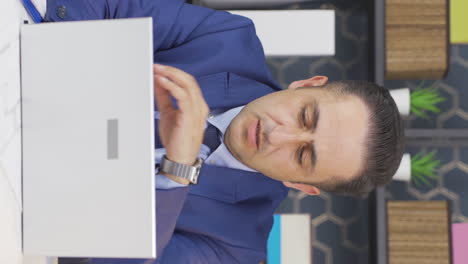 Vertical-video-of-Stressed-businessman-experiencing-time-pressure.